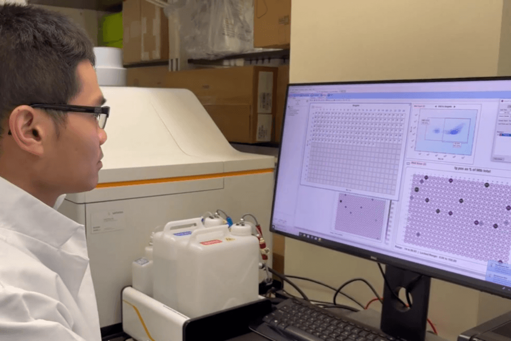 Dr. Joshua Tan (NIH) analyzing research data 