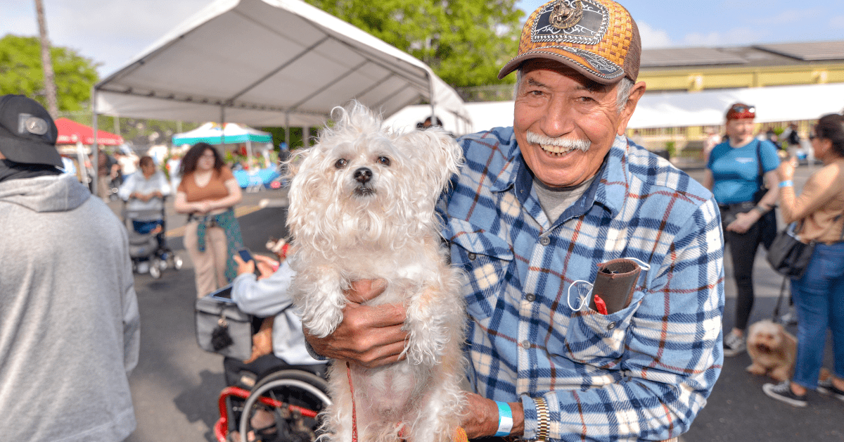 Boyle Heights resident holding dog