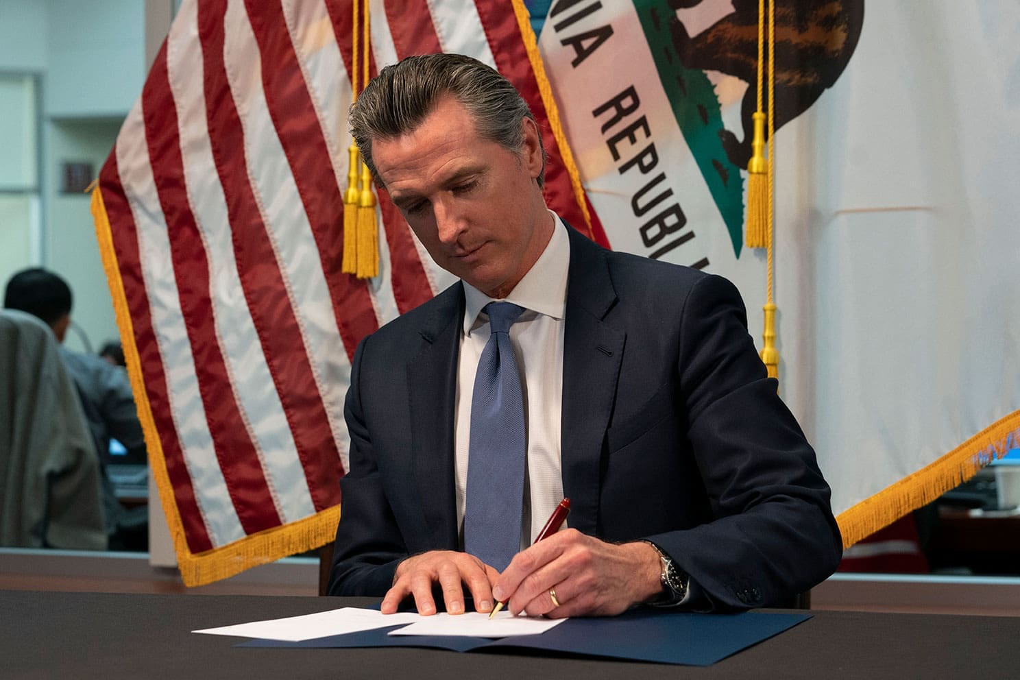 Gov-Newsom-signing-a-bill
